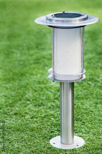 Photography Solar-powered lamp on green grass background.