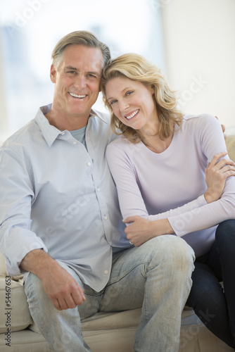Loving Couple Smiling Together At Home