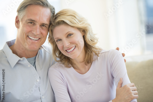 Couple Smiling Together At Home