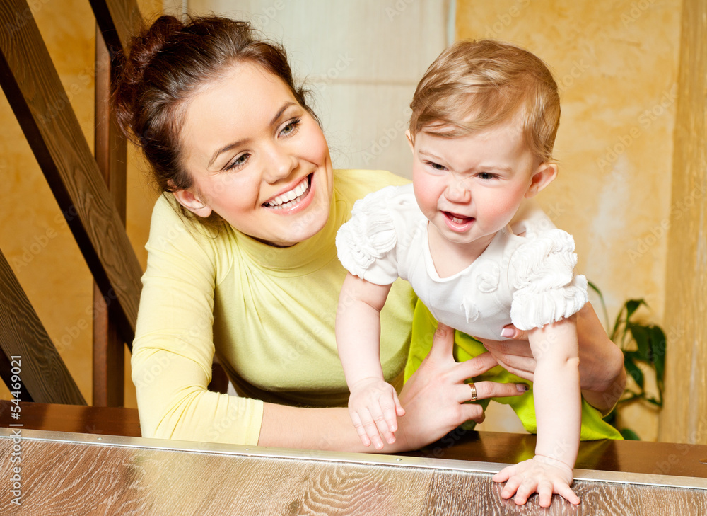 Young mother and daughter playing at home Young mother and daughter playing at home