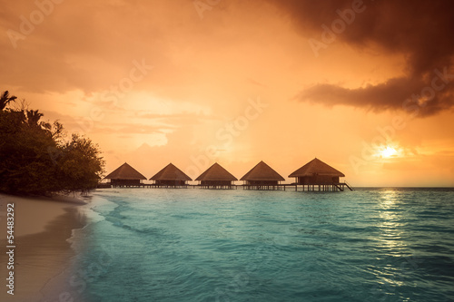 Over water bungalows with steps into amazing green lagoon