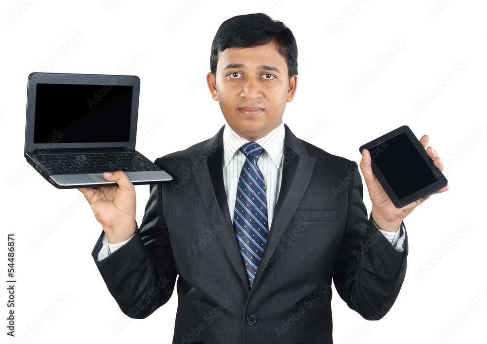 Indian Businessman Holding Laptop and Tablet Indian Businessman Holding Laptop and Tablet
