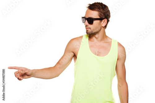 Casual man in sunglasses pointing with the hand