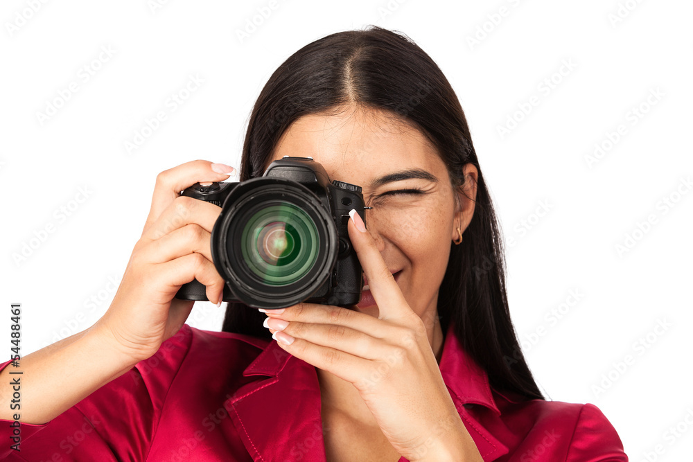Young cheerful woman taking a picture over white Young cheerful woman taking a picture over white