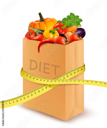 Fresh vegetables in a paper grocery bag with measuring tape. Con