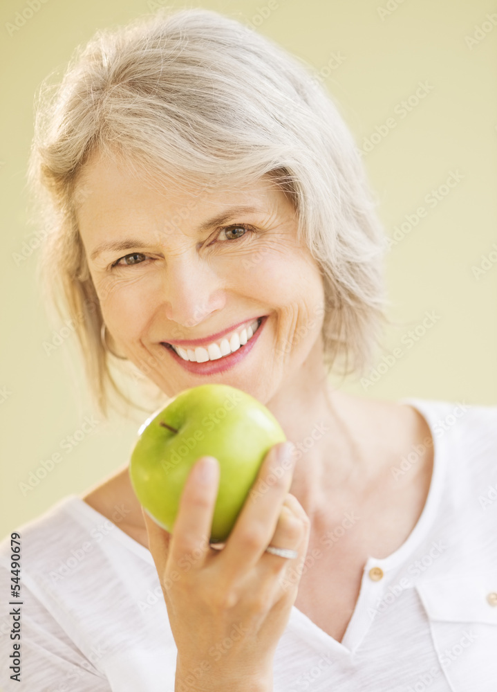 Happy Woman Holding Granny Smith Apple Happy Woman Holding Granny Smith Apple