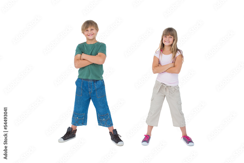 Smiling children with their arms crossed Smiling children with their arms crossed