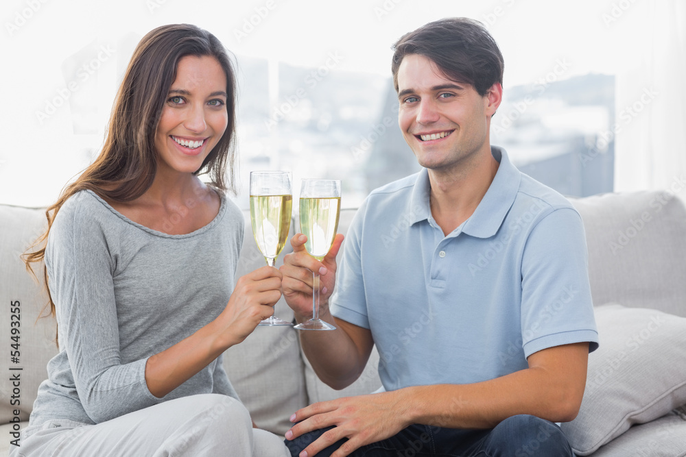 Portrait of lovers clinking their flutes of champagne Portrait of lovers clinking their flutes of champagne