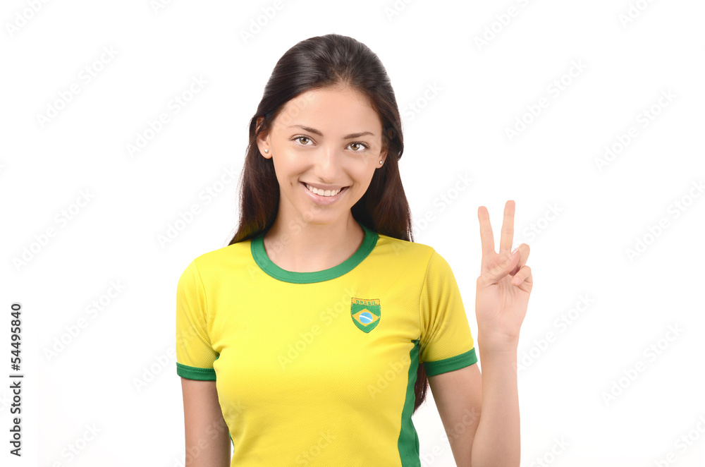 Girl with Brazilian flag on her shirt signing victory for Brazil Girl with Brazilian flag on her shirt signing victory for Brazil