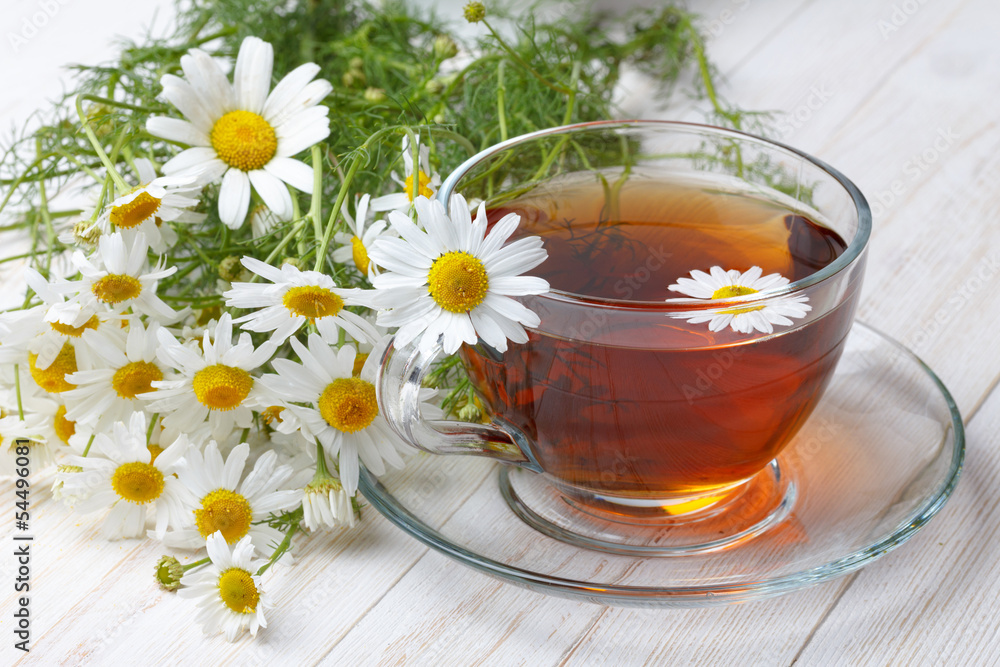 Chamomile tea on wooden table still life Chamomile tea on wooden table still life