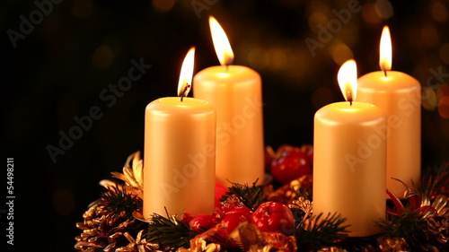 Candles on advent wreath and black copy space.