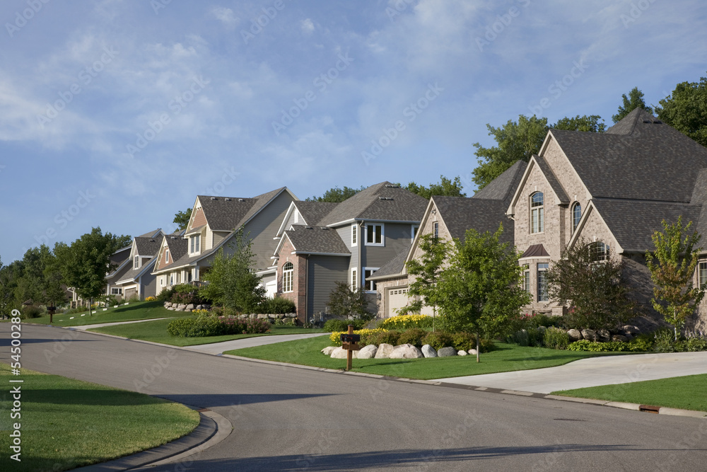 © Daniel Thornberg - Houses on upscale suburban street in morning sunlight © Daniel Thornberg - Houses on upscale suburban street in morning sunlight