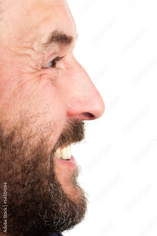 Side portrait closeup of mature adult man, laughing Side portrait closeup of mature adult man, laughing