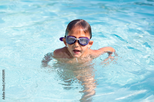 Little boy at the swimming pool