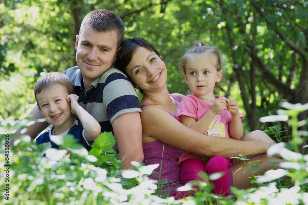 Happy family with two children sitting