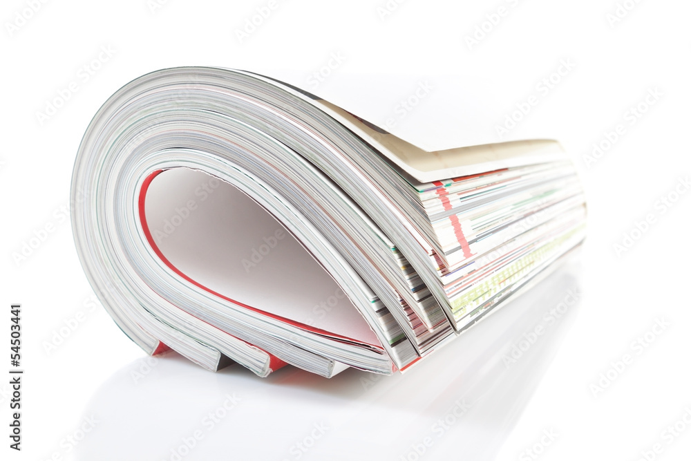 Group monthly magazine. Close-up on a white background. Group monthly magazine. Close-up on a white background.