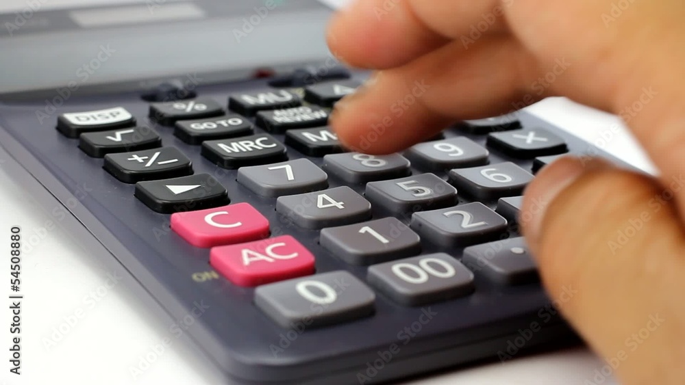 Businessman using a calculator Businessman using a calculator