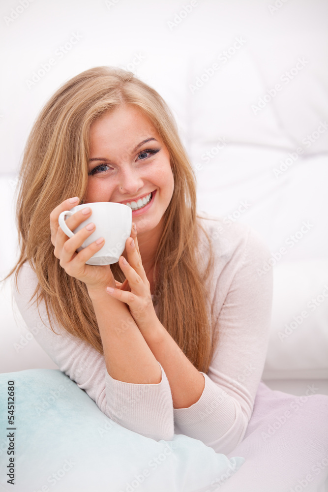 woman holding white cup woman holding white cup