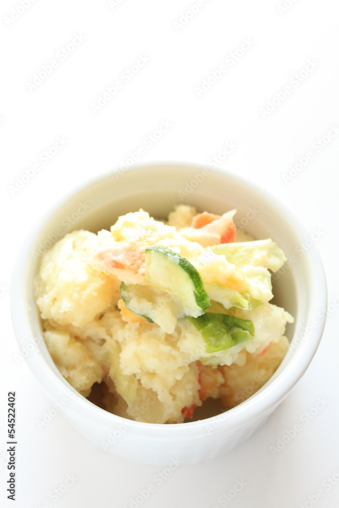 homemade potato salad on white background with copy space