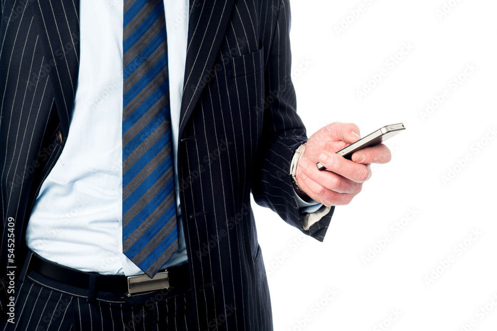 Guy operating his mobile phone Guy operating his mobile phone