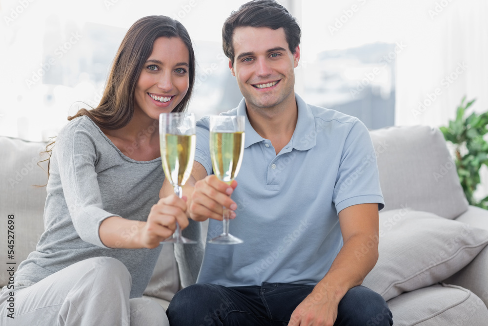 Portrait of lovers toasting their flutes of champagne Portrait of lovers toasting their flutes of champagne