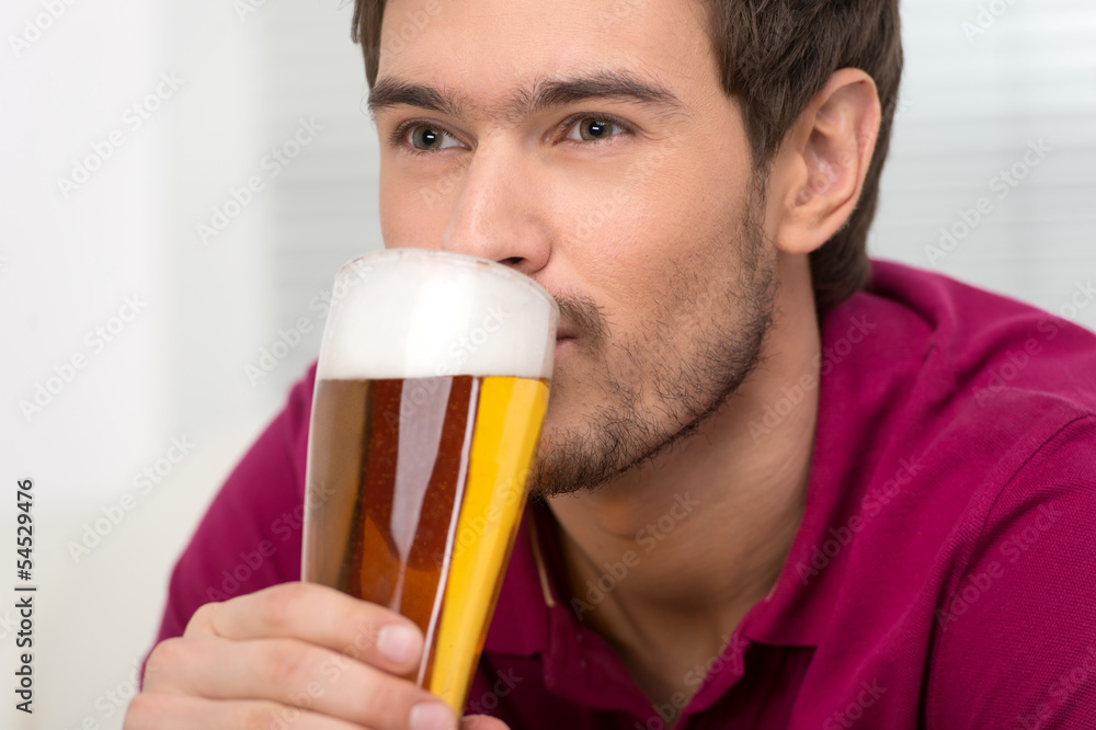 Men drinking beer. Portrait of handsome young men drinking beer Men drinking beer. Portrait of handsome young men drinking beer