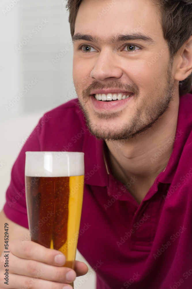 Happy men drinking beer. Portrait of handsome young men drinking Happy men drinking beer. Portrait of handsome young men drinking