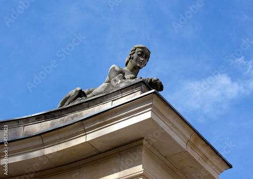 Sphinx sculpture of a woman against the sky