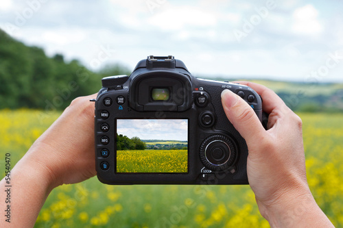 Canvas Print Taking a photo with a dslr camera