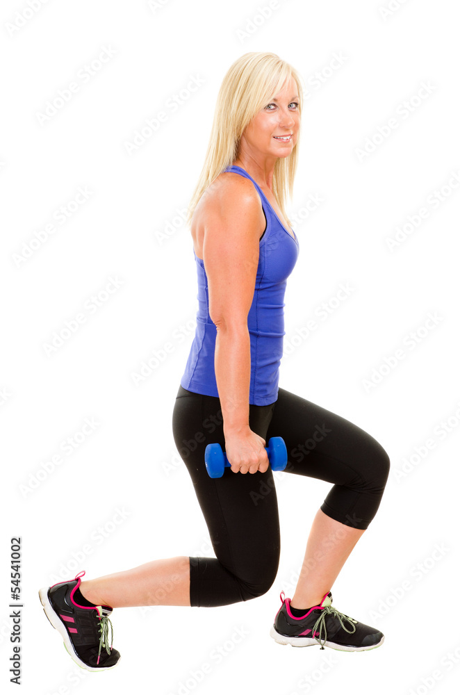 Healthy middle aged woman exercising with dumbbells Healthy middle aged woman exercising with dumbbells