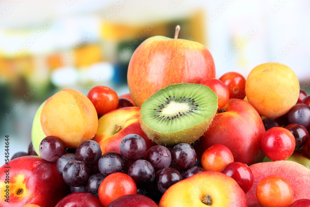 Assortment of juicy fruits on bright background Assortment of juicy fruits on bright background