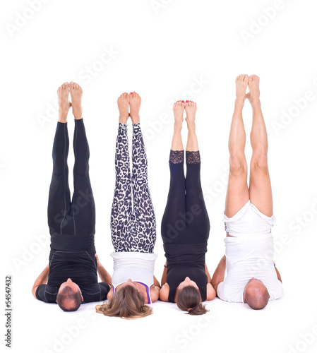 Yoga in group / Shoulderstand - Sarvangasana - Viparita Karani photo