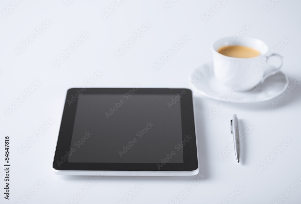 tablet pc with cup of coffee tablet pc with cup of coffee