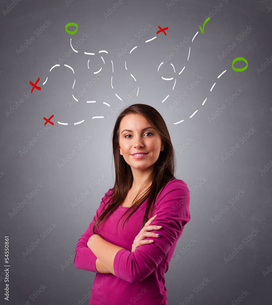 Young woman thinking with abstract marks overhead Young woman thinking with abstract marks overhead