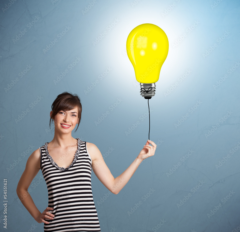 Pretty lady holding a light bulb balloon Stock Photo | Adobe Stock