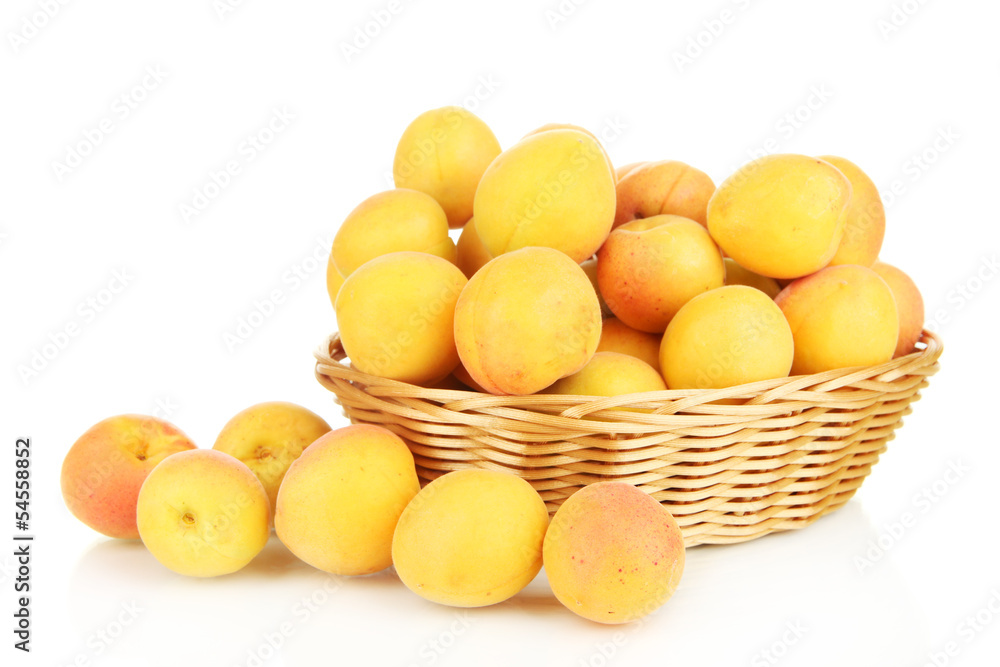 Fresh natural apricot in wicker basket isolated on white Fresh natural apricot in wicker basket isolated on white