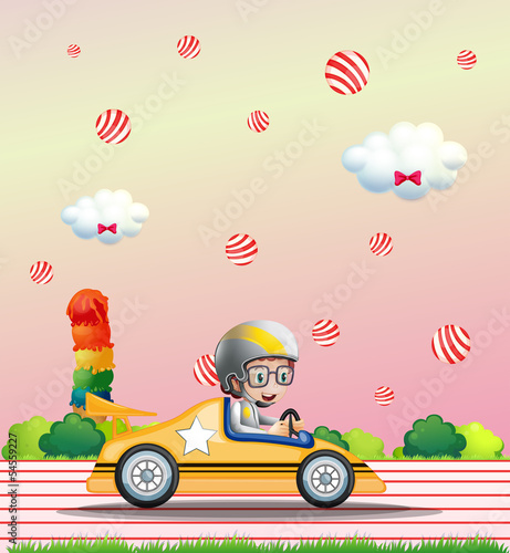 A boy riding on a car