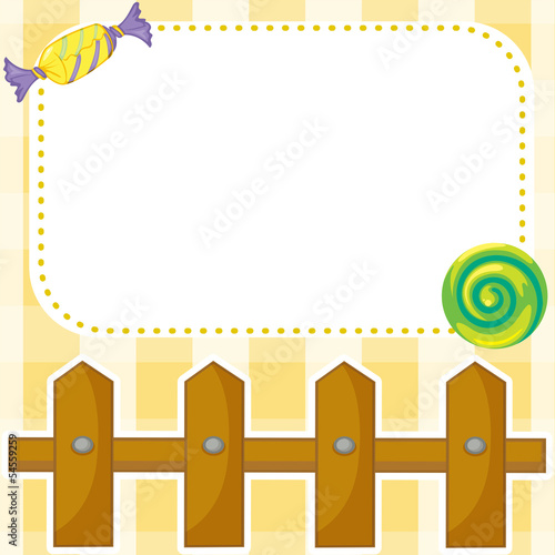 A stationery with candies and wooden fence