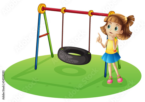 A girl thinking beside a swing