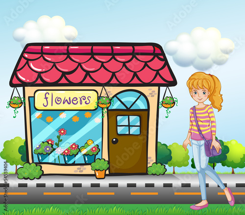A girl with a bag outside the flower shop