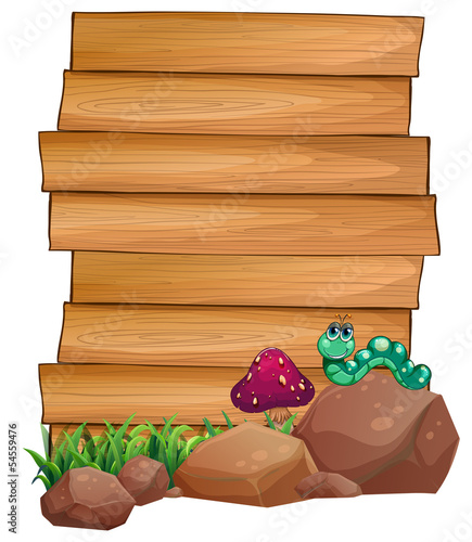 Empty wooden boards near the rocks with a worm