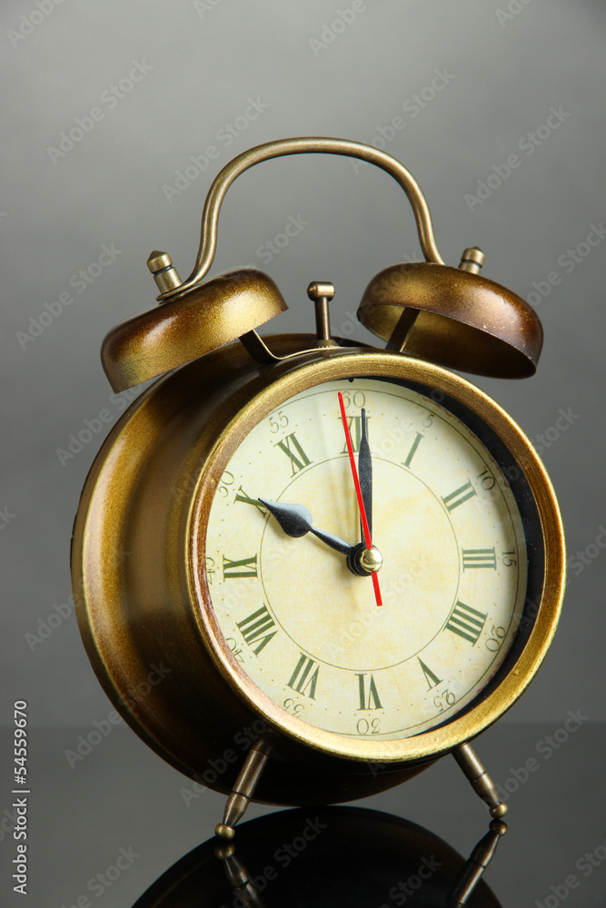 Old alarm clock on gray background Old alarm clock on gray background