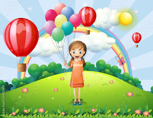 A girl holding balloons