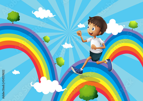 A boy running above the rainbow