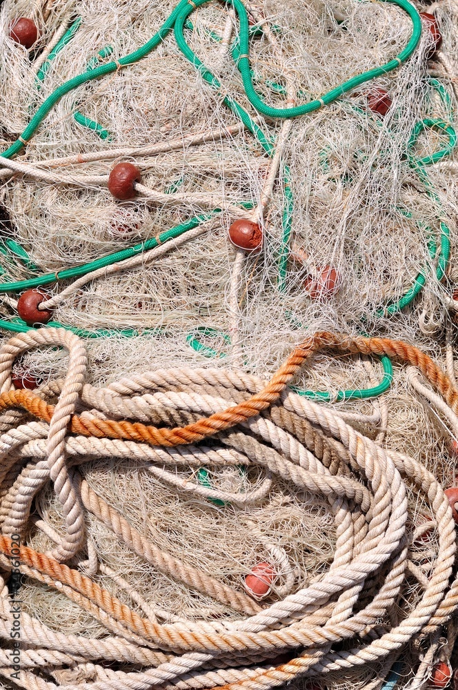 Texture of pile of fishing nets with floats. Podgora, Croatia