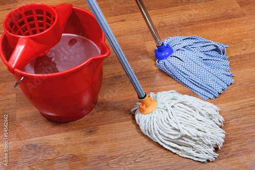 cleaning of wet floors by two mops