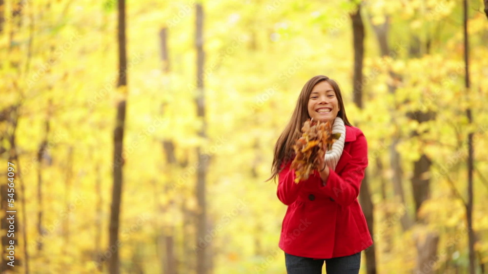 Happy girl playing in autumn leaves, fall forest Happy girl playing in autumn leaves, fall forest