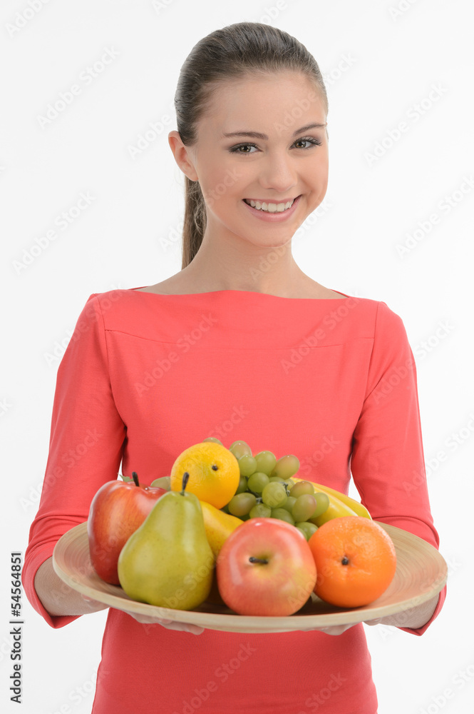 Teenage girl with fruits. Happy teenage girl holding a plate wit Teenage girl with fruits. Happy teenage girl holding a plate wit
