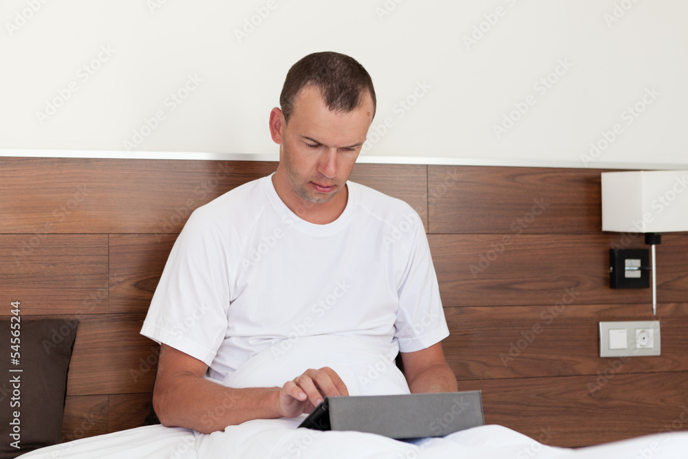 Portrait of man using tablet computer Portrait of man using tablet computer