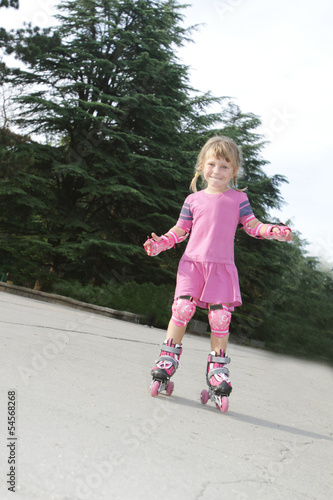 Wallpaper Mural young happy girl riding roller blades outdoors Torontodigital.ca